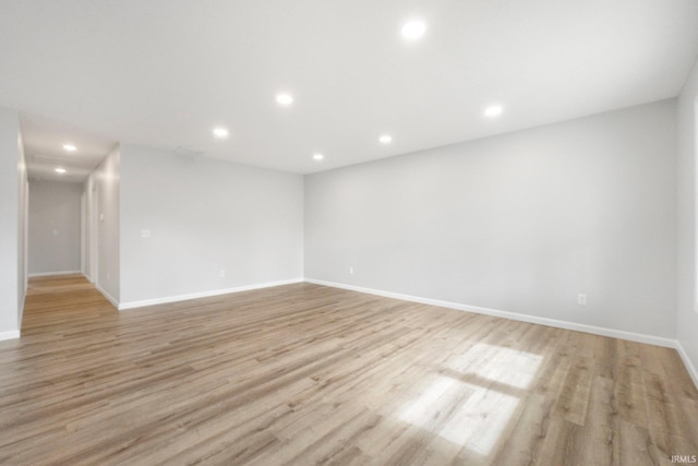 spare room with light hardwood / wood-style floors