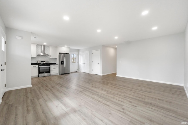 unfurnished living room featuring light hardwood / wood-style flooring