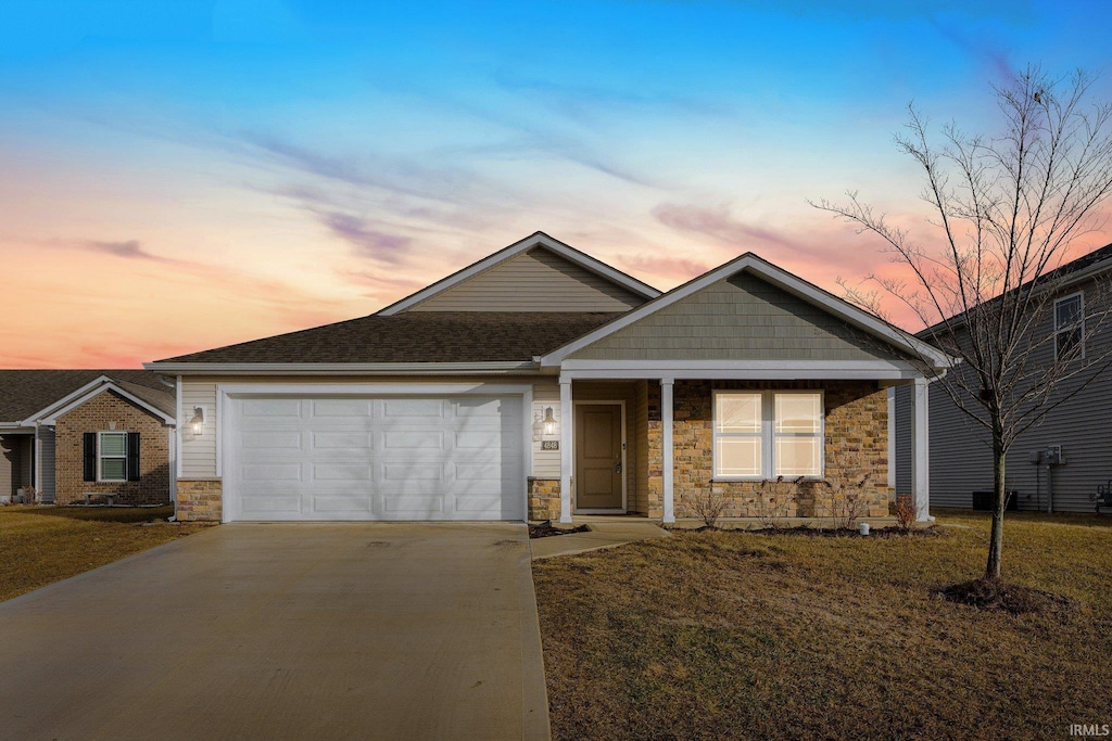 4848 Little Colorado Cv, Fort Wayne, IN 46808 - view of front of property with a garage and a yard