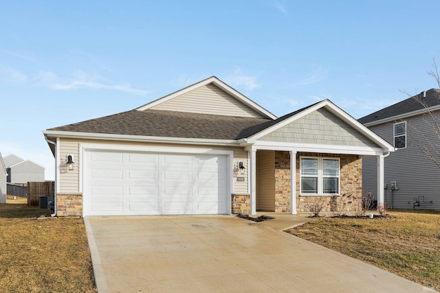 craftsman house featuring a garage and a front yard