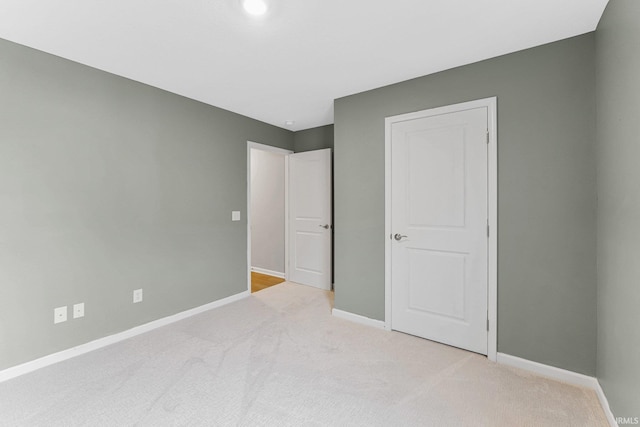 unfurnished bedroom with light carpet