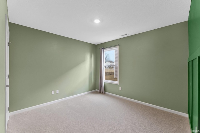 empty room with light colored carpet