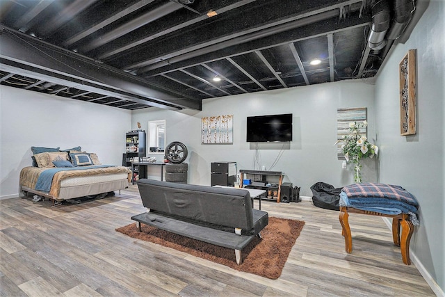 bedroom with wood-type flooring