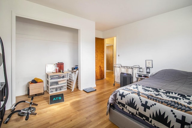 bedroom with hardwood / wood-style floors