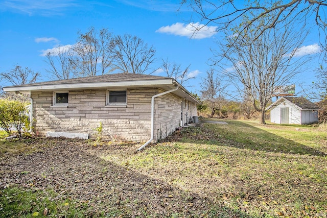 view of property exterior featuring a yard and a shed