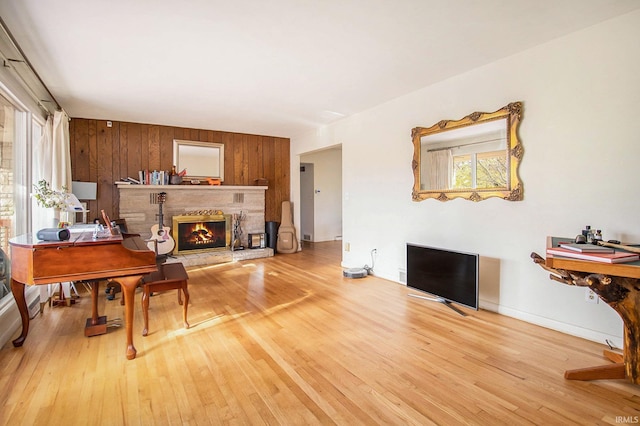 living room featuring hardwood / wood-style floors and wood walls