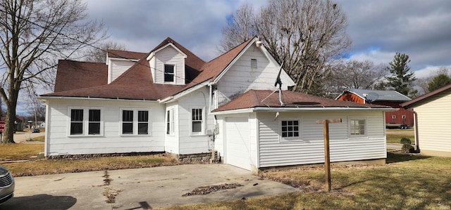 rear view of house with a lawn