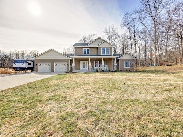 view of front facade with a garage, a front yard, and covered porch