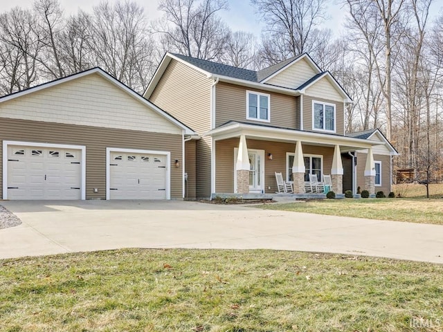 view of front facade with a garage, covered porch, and a front lawn