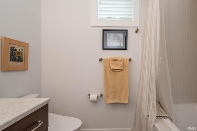 full bathroom featuring toilet, vanity, and shower / bathtub combination with curtain