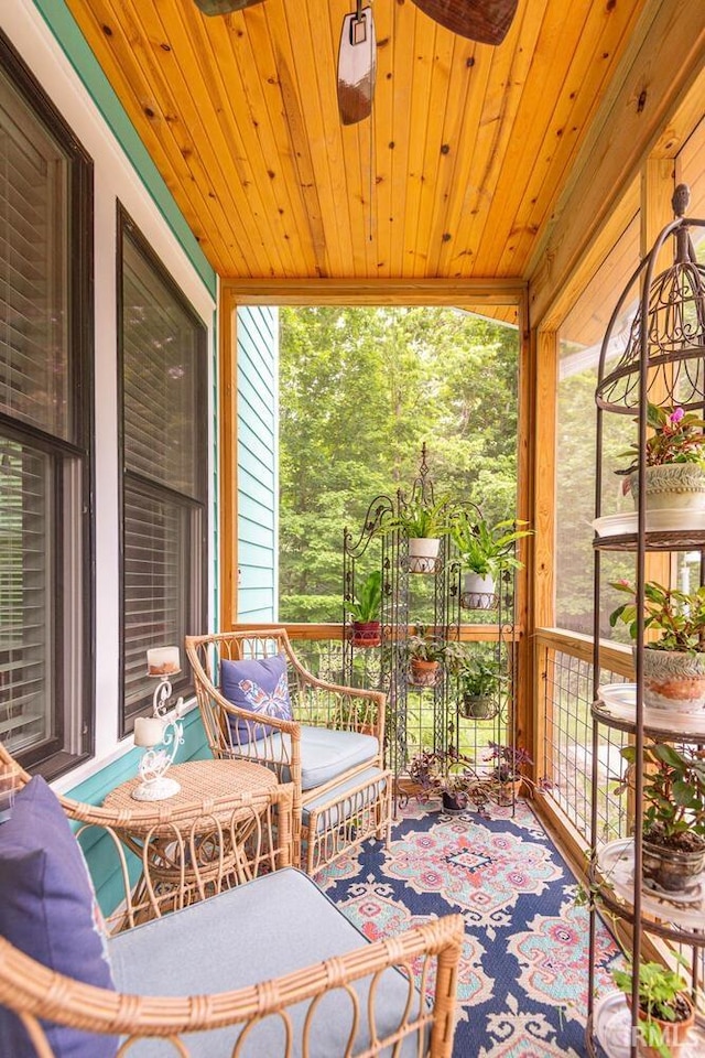 sunroom featuring wooden ceiling