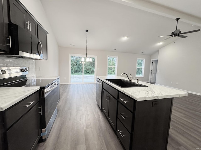 14812 Verona Lakes Psge, Fort Wayne, IN 46814 - kitchen with appliances with stainless steel finishes, a sink, wood finished floors, dark cabinets, and backsplash