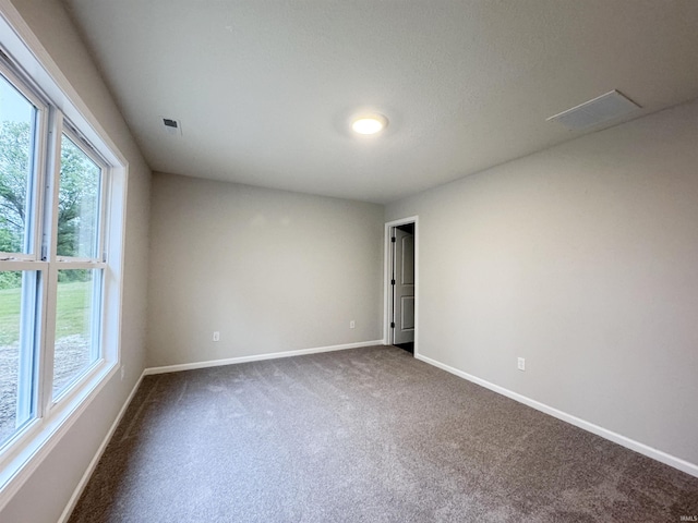 14812 Verona Lakes Psge, Fort Wayne, IN 46814 - spare room featuring dark colored carpet and baseboards