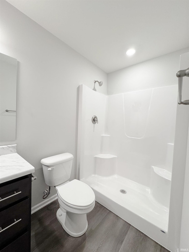 14812 Verona Lakes Psge, Fort Wayne, IN 46814 - full bathroom featuring vanity, wood finished floors, toilet, a shower, and recessed lighting