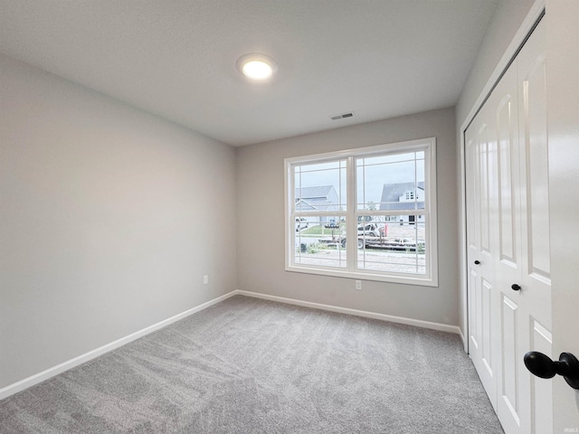 14812 Verona Lakes Psge, Fort Wayne, IN 46814 - unfurnished bedroom with carpet flooring, baseboards, and a closet