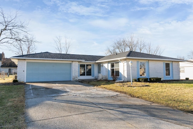 ranch-style house with a garage and a front yard