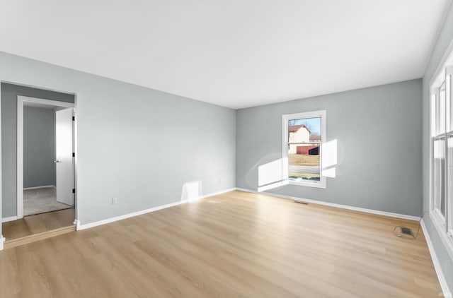 unfurnished room with light hardwood / wood-style flooring