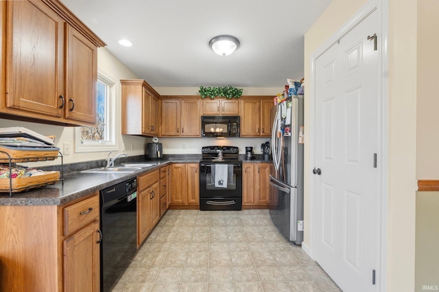 kitchen with sink and black appliances