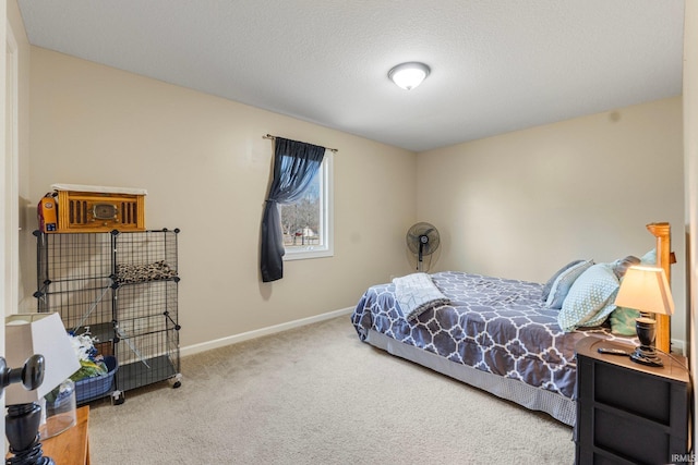 bedroom with carpet and a textured ceiling