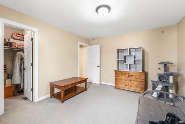 interior space with carpet flooring and a spacious closet