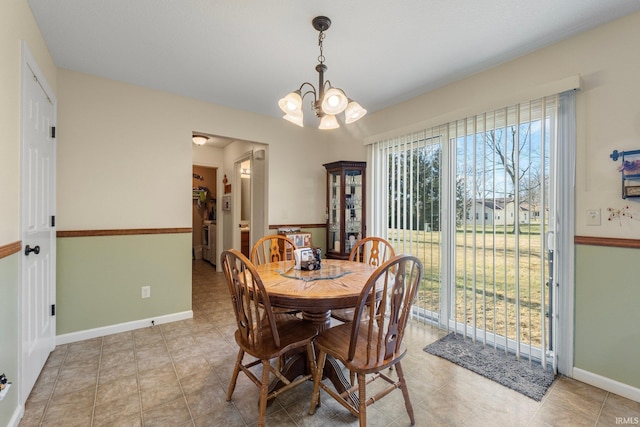 dining room with plenty of natural light and a chandelier