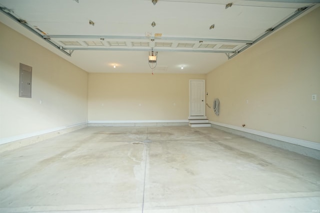 garage featuring a garage door opener and electric panel