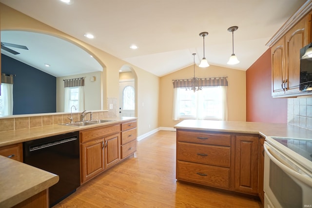 kitchen featuring white range with electric cooktop, lofted ceiling, black dishwasher, and sink