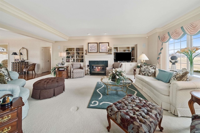 living room with ornamental molding and carpet