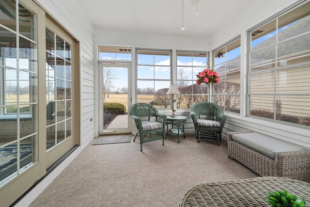 sunroom / solarium with a healthy amount of sunlight