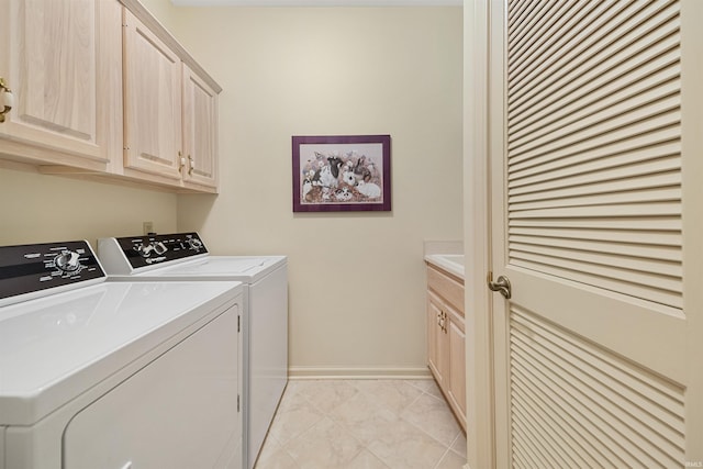 laundry area with cabinets and washing machine and dryer