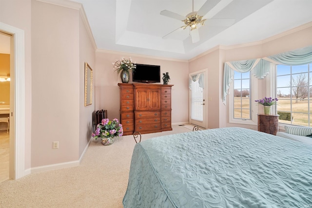 bedroom with crown molding, ceiling fan, a raised ceiling, and light carpet