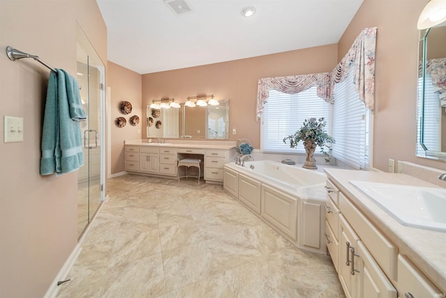 bathroom featuring vanity and separate shower and tub