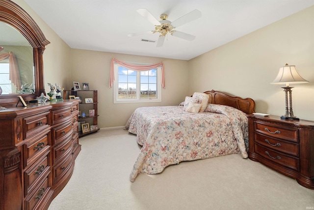 bedroom featuring light carpet and ceiling fan