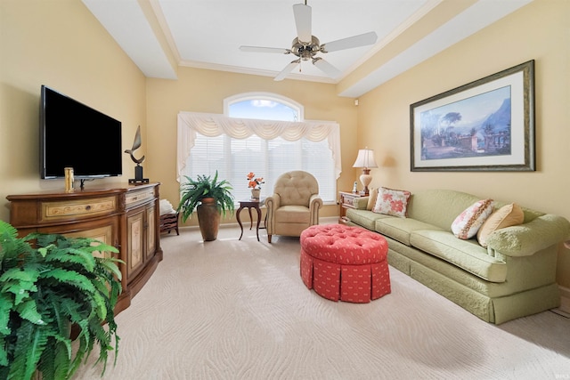 carpeted living room featuring crown molding and ceiling fan