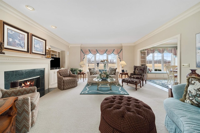 living room featuring a tiled fireplace, crown molding, and carpet