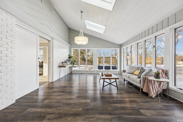 sunroom / solarium featuring lofted ceiling with skylight, plenty of natural light, and wooden ceiling