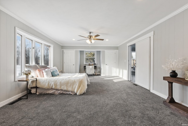 carpeted bedroom featuring crown molding and ceiling fan