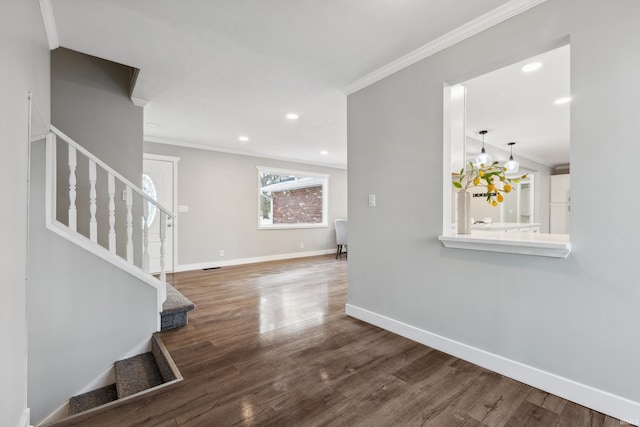 interior space with crown molding and hardwood / wood-style flooring