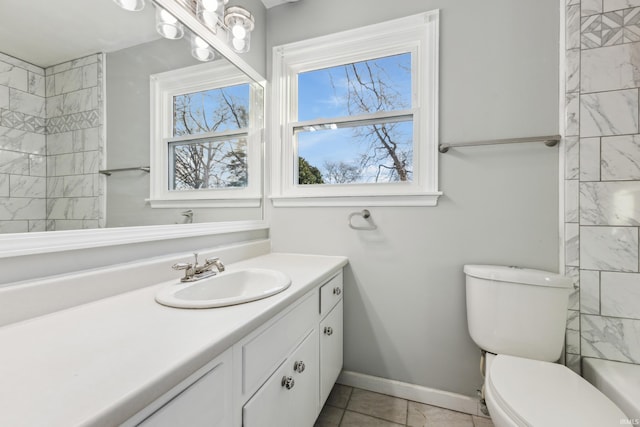 bathroom with vanity, plenty of natural light, and toilet