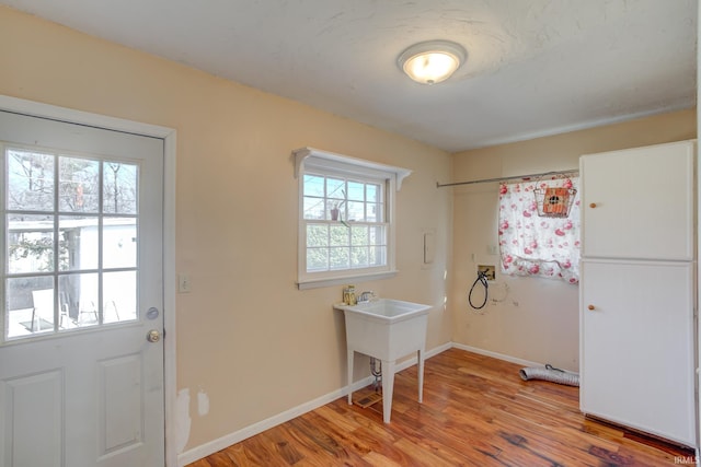 interior space with hardwood / wood-style flooring and washer hookup