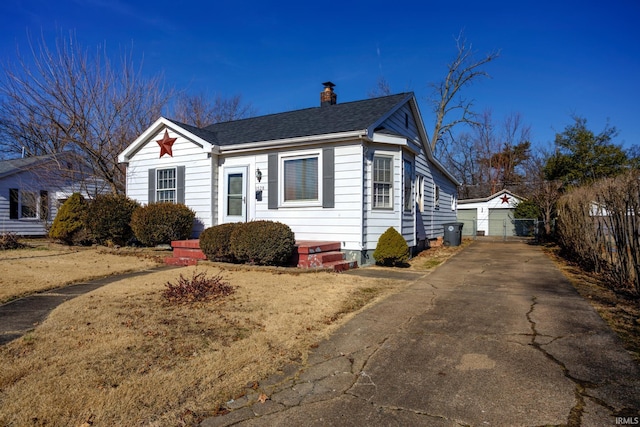 view of property exterior featuring an outbuilding and a garage