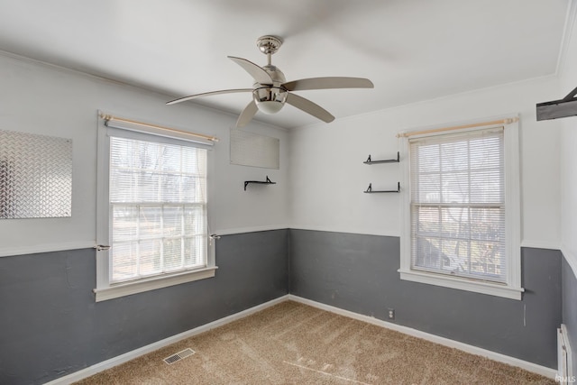 unfurnished room featuring carpet flooring and ceiling fan