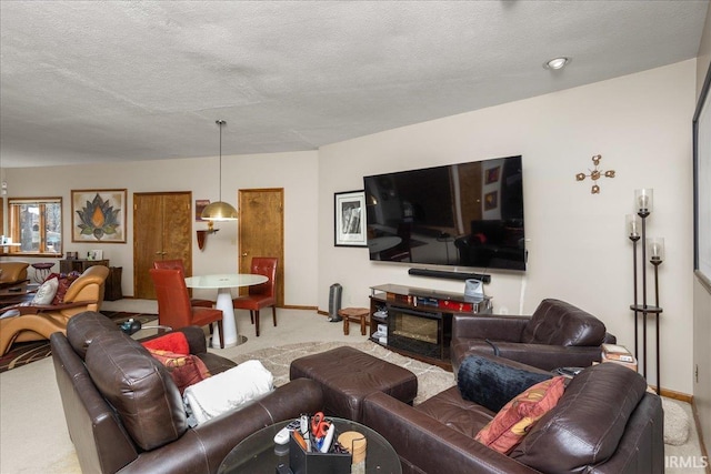 carpeted living room with a textured ceiling