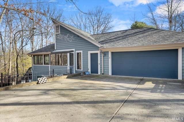 ranch-style home featuring a garage