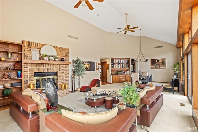 carpeted living room featuring ceiling fan, a fireplace, and high vaulted ceiling