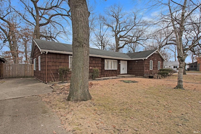 ranch-style house with a front lawn