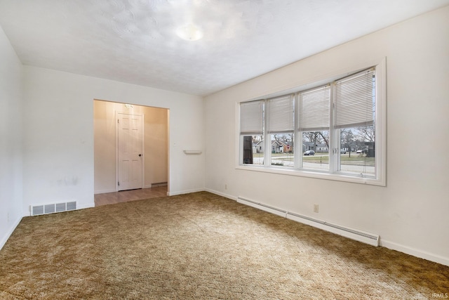 unfurnished bedroom featuring a baseboard heating unit and carpet floors