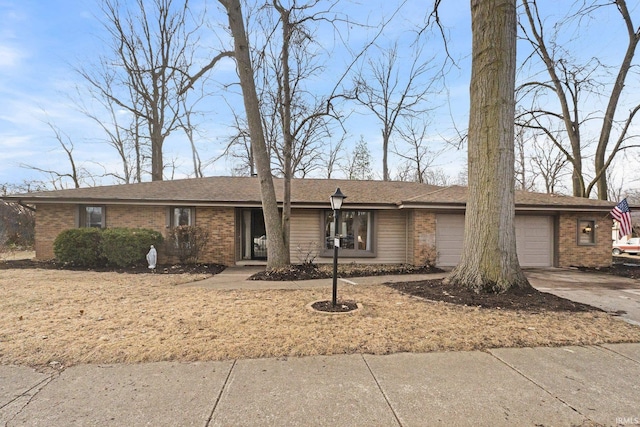 ranch-style house featuring a garage