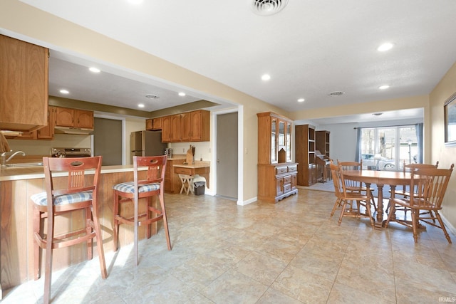 dining area featuring sink