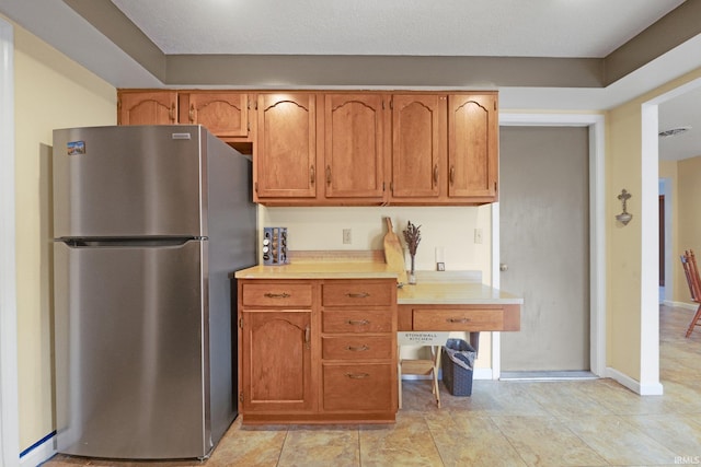 kitchen with stainless steel fridge